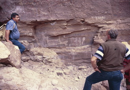 Guide showing cave paintings