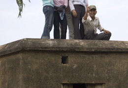Vietnamese kids on top of an old bunker