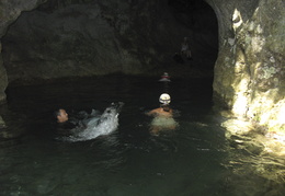 swimming into the mouth of the cave
